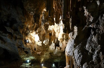 Inside of beautiful old dark cave with many stalactites. Grotte di Is Zuddas, Italy, Sardinia
