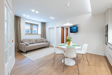 Contemporary Living Room and Dining Area with Sofa and Small Dining Table