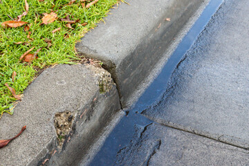 gutter and road with water after rain
