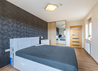 Modern Minimalist Bedroom Design Featuring Sleek Furniture and Elegant Interior Details