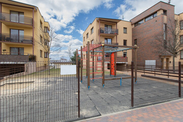Urban Playground Area in Residential Neighborhood Surrounded by Modern Apartment Buildings