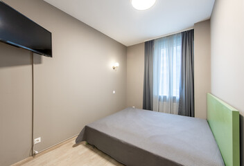Modern Minimalistic Bedroom Interior with Gray Decor and Stylish Furniture