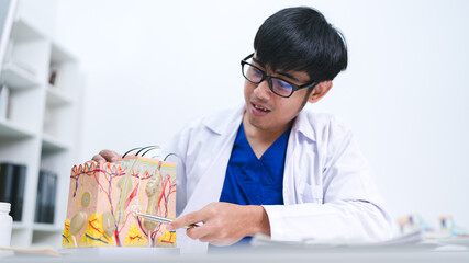 The dermatologist at the hospital examined the patient’s skin, identifying symptoms linked to a follicle problem and offering treatment for better human skin protection.