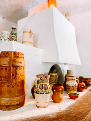 Colorful pottery and wooden decorations in a rustic setting with a cozy atmosphere