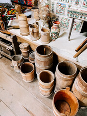 Wooden containers and decorative pottery showcased in a cultural craftsmanship space