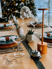 Elegant dining setup in contemporary decor with festive background and tasteful details