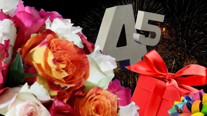 Birthday card  in numbers , roses, gift, fireworks light sky. Age is 45