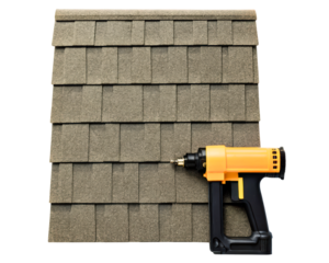 Nail gun on a section of asphalt composition roof shingles on a transparent background