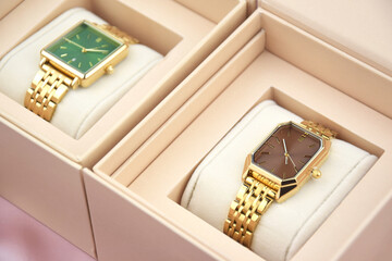Closeup minimal fashion wristwatch for women on pink background.