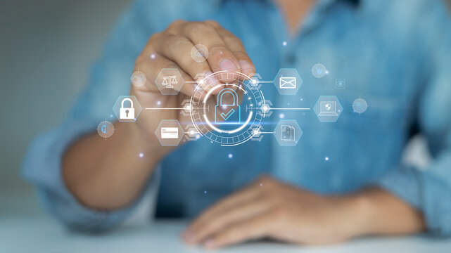 Businessman using virtual interface with security lock icon, representing cybersecurity, data privacy protection, and digital technology safety.