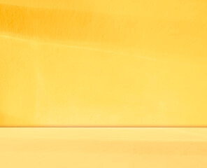 Yellow background wall gradient orange color studio room solid podium with shadow leaf on floor,...
