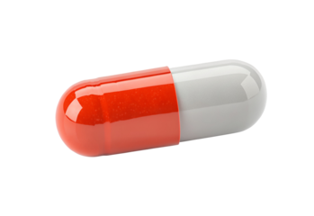 Transparent capsule with red and white side on black background in close-up view of medicine