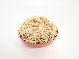 raw ramen noodle in pink bowl isolated on white background. fresh egg ramen noodle isolated on white background