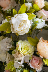 bouquet of artificial yellow and pink flowers, close-up
