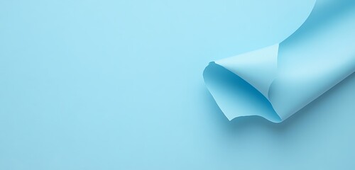 aqua blue paper sheet with soft wrinkle and corner uplifted on background