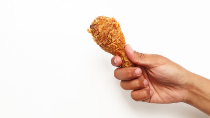Hand hold fried chicken isolated on white background  © VerraWidhi