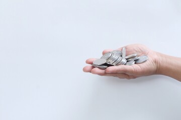 Coins in hand. Saving money. Saving money