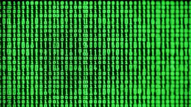 Digital stream of green binary code on a dark background