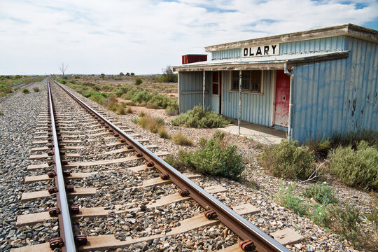 A deserted railway station along side a railway line