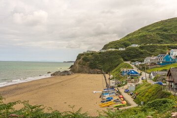 Tresaith Cardigan Ceredigion, Wales UK sheltered deserted sandy beach cove with sailling boats and lifeguard station