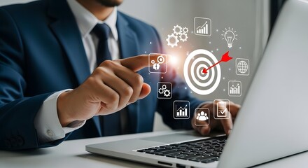 Businessman pointing at a digital target, symbolizing business goals and success.