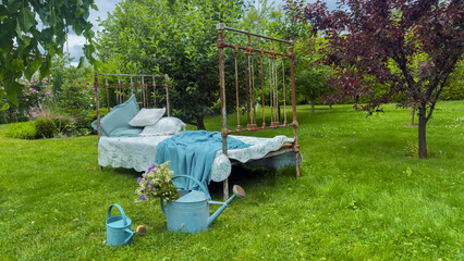 Charming Vintage Bed Set Amidst Lush Greenery, Showcasing a Quaint Outdoor Seating Area with Soft...
