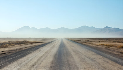 Fototapeta premium asphalt road laid through the desert, going into the distance. in the distance the road is obscured by sand dust. mountains are visible on the horizon