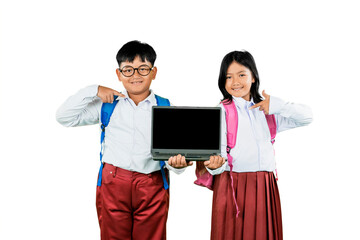 Smiling Indonesian Schoolchildren Pointing at Laptop Screen Isolated on White Background