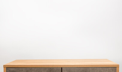 empty dresser and gray wall with copy space