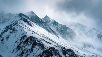 Majestic snow covered mountains dramatic winter landscape windy weather