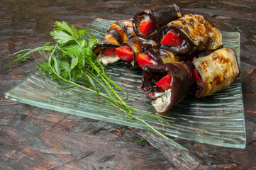Eggplant Rolls on Glass Plate with Herbs