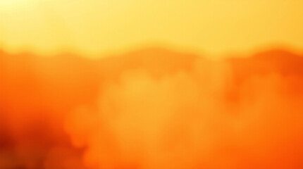 Vibrant sunset sky with warm orange and yellow hues, tranquil clouds.