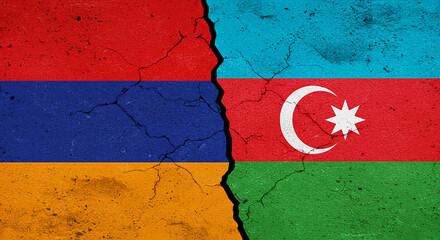 Divided Nation: The national flags of Armenia and Azerbaijan are bisected, illustrating the tense geopolitical relations between the two countries. The raw.