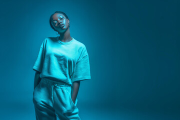 Moody portrait woman blue light emotional expression anxiety concept mental health awareness introspective fashion editorial minimal solitude selfacre therapy background awareness campaign space ad