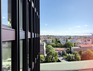 Close-up of a high-rise facade from the outside looking over the city