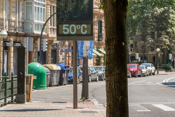 Street thermometer in Bilbao showing extreme 50 degrees Celsius heat in summer