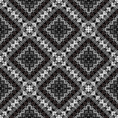 Intricate geometric pattern featuring black and white designs with star like shapes and diagonal lines, creating visually striking effect