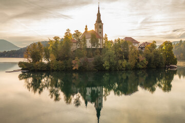 Aerial view of majestic Lake Bled at sunrise in autumn, Slovenia.