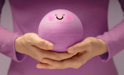 Hands gently holding Smiling Circle face. Mental health, emotional balance,inner peace through meditation and mindfulness. symbolizing good mental and self-awareness