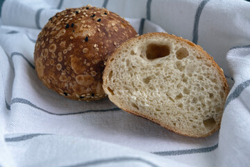 A small bun of white flour on a kitchen towel.