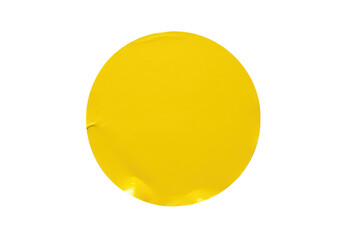 A bright yellow round sticker isolated on transparent background with slight wrinkles