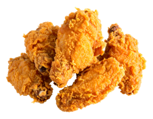 Crispy golden fried chicken pieces are stacked together, highlighting their delicious texture and inviting appearance.