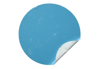 A round blue sticker with a peeled corner isolated on transparent background