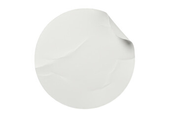 A blank white round sticker with a curled corner is isolated on transparent background