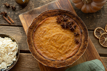 Pumpkin pie garnished with anise. Homemade traditional American thanksgiving pie, top view