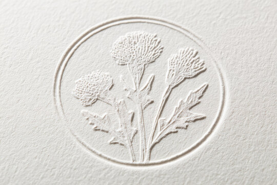 Embossed botanical stamp mockup featuring delicate thistle flowers in circular frame on textured off white paper, minimal and elegant design for stationery or branding