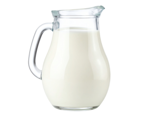 Fresh milk in a clear glass pitcher.