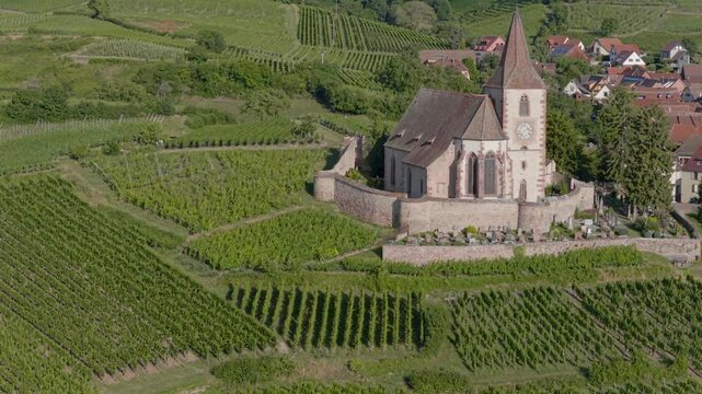 Hunawihr, France - Aerial view of Alsacian village and vineyards and sunrise