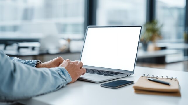 Modern professional typing on clean blank laptop screen mockup in contemporary office setting hands busy with digital work online business development productivity focus