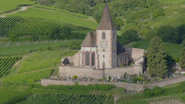 Hunawihr, France - Aerial view of Alsacian village and vineyards and sunrise